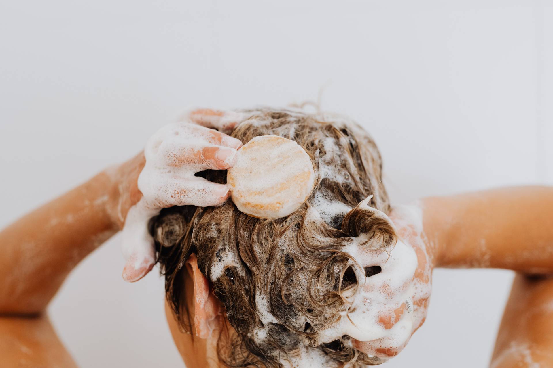 Why your hair gets greasy so fast — and how to train your scalp to need washing just once a week